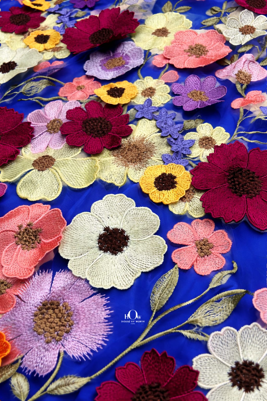 3d flower fabric royal blue close-up showing sculpted texture, premium floral net for couture