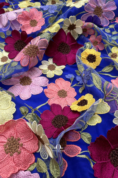 Royal blue floral applique fabric with elevated 3D blooms on net, made for evening gowns