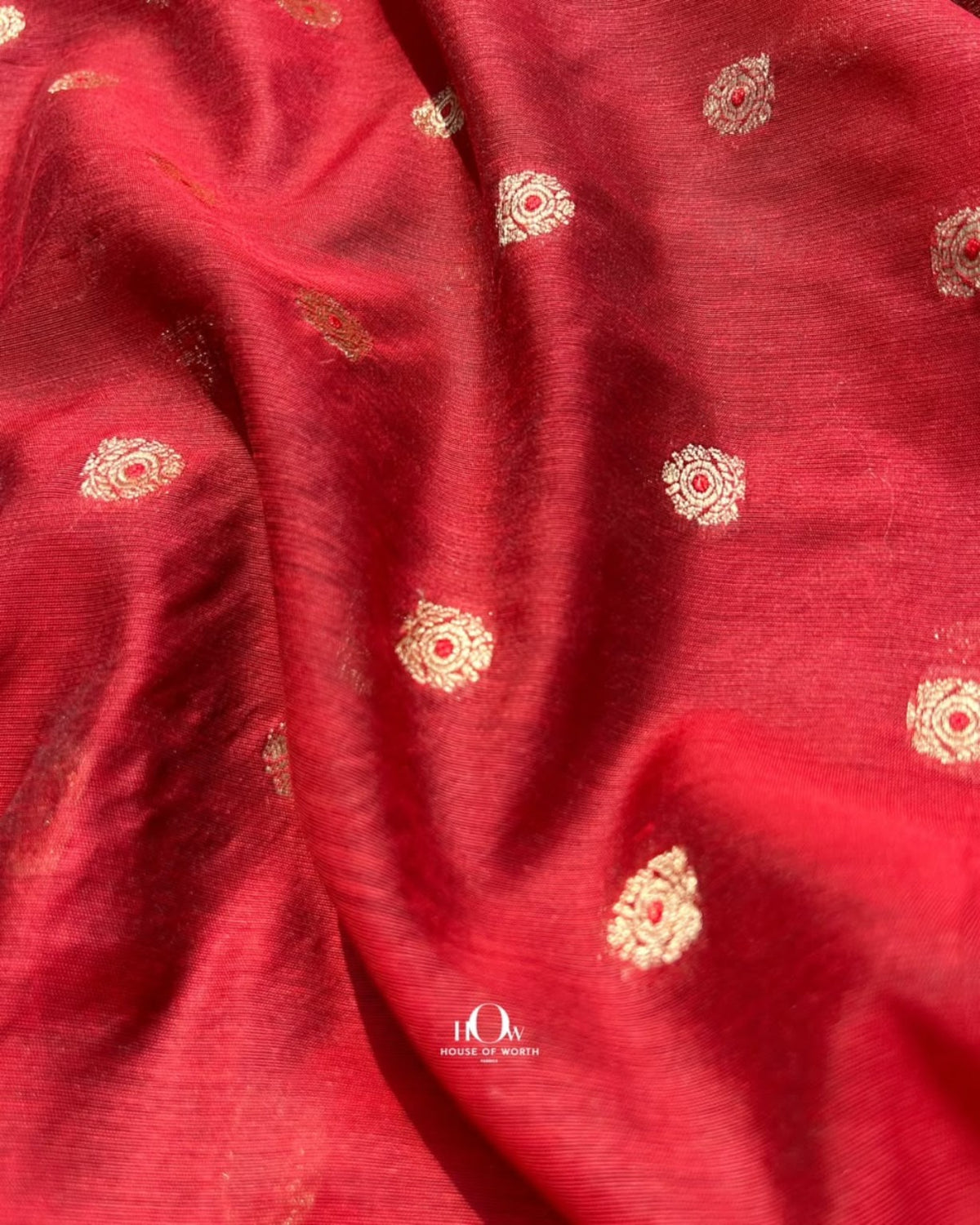 Rust orange Chanderi fabric with gold toned decorative motifs for designer ethnic wear