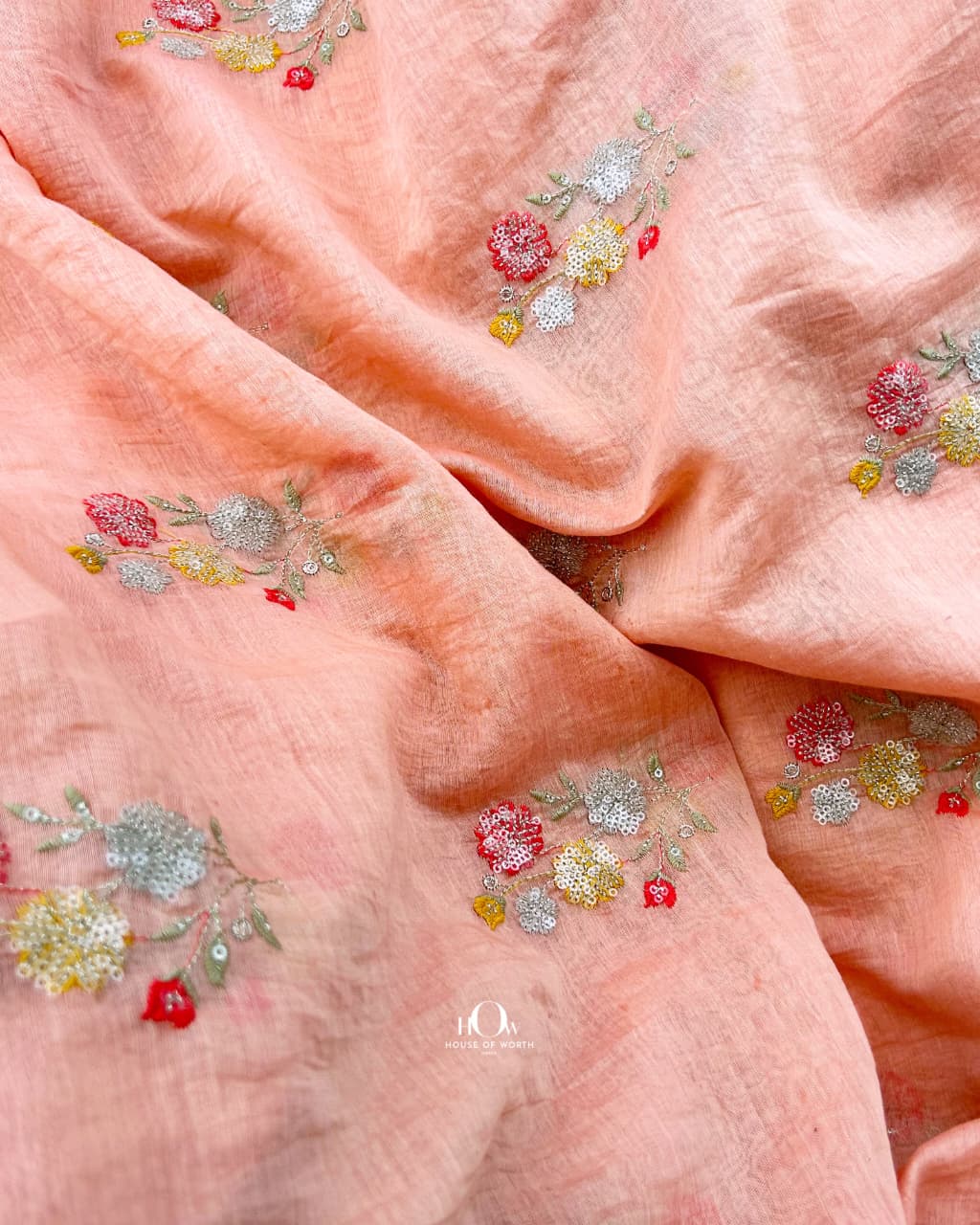 Salmon pink Pure Mul Chanderi showing spaced floral bouquet motifs