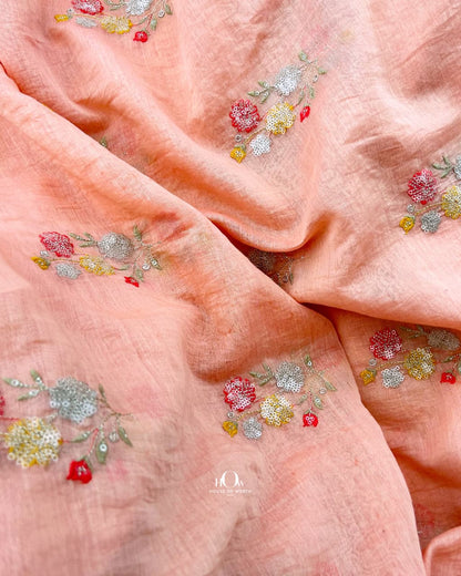 Salmon pink Pure Mul Chanderi showing spaced floral bouquet motifs