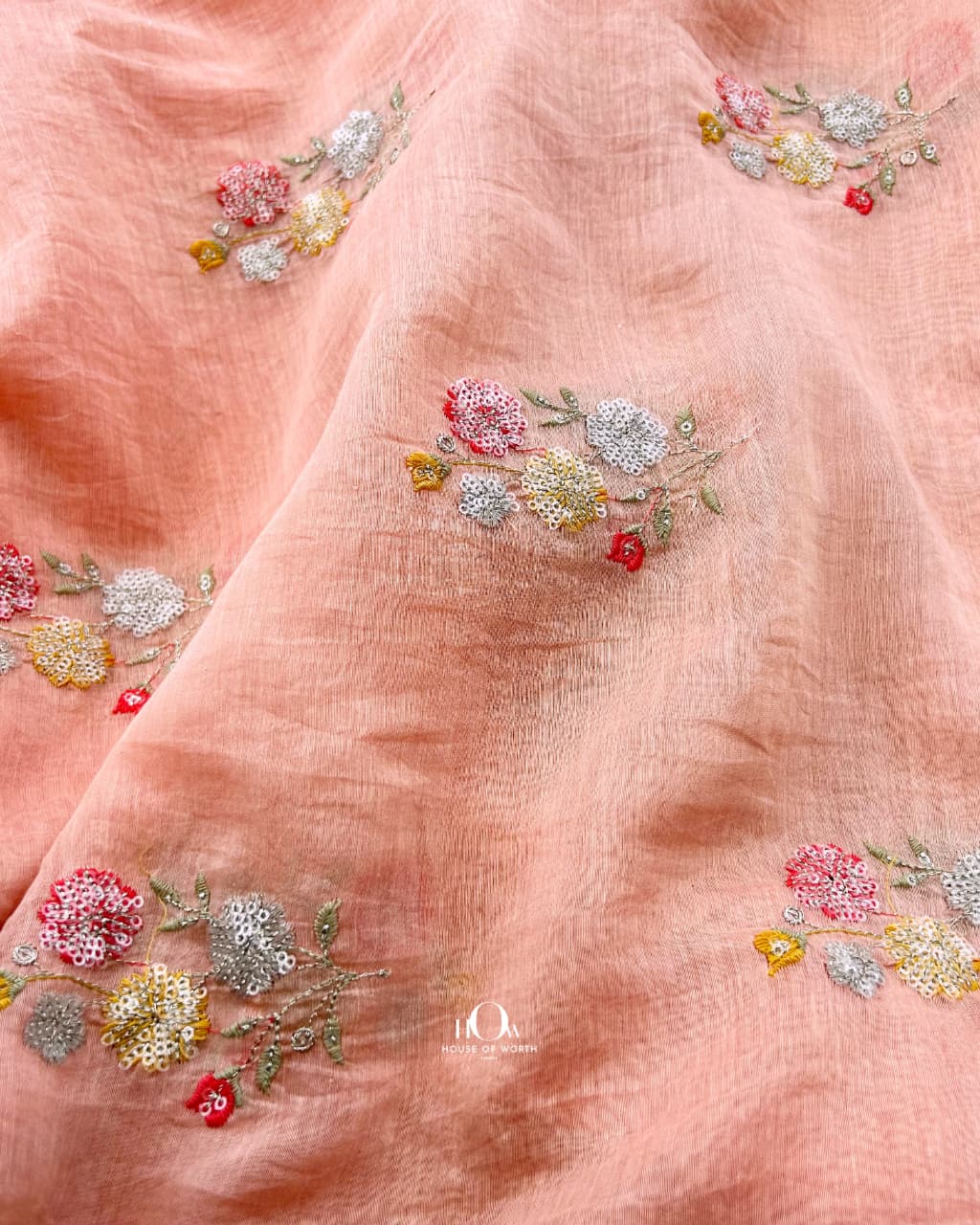 Salmon pink embroidered Mul Chanderi fabric suited for sarees, kurtas and dupattas