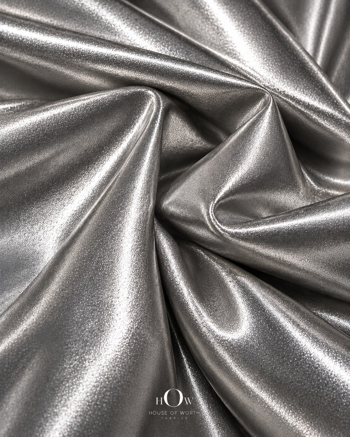 Silver shiny metallic Lycra fabric drape for dresses, stagewear and statement fashion