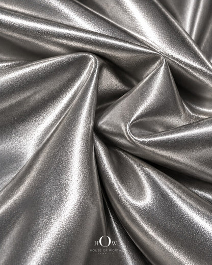 Silver shiny metallic Lycra fabric drape for dresses, stagewear and statement fashion