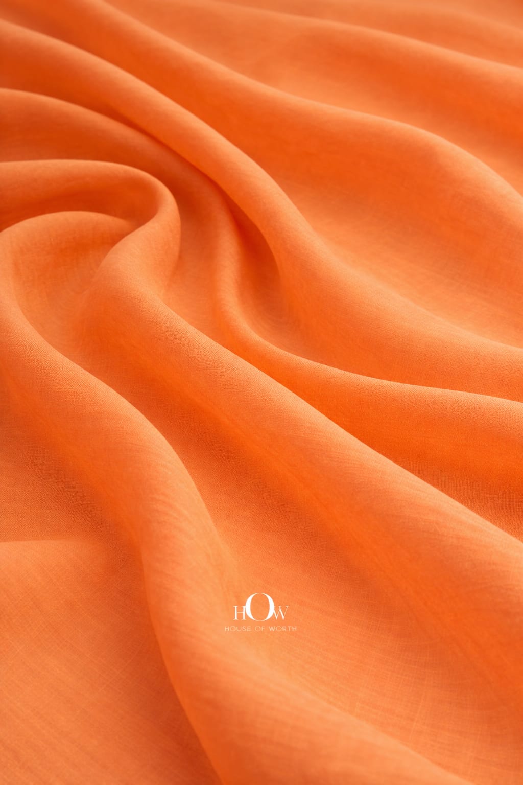 Orange cotton poplin fabric with crisp structured drape