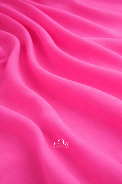 Bright pink cotton poplin fabric with structured smooth drape