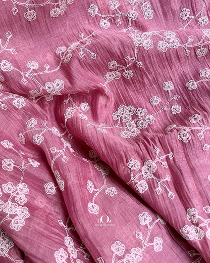Mul Chanderi fabric wholesaler in Surat offering pink embroidered material for festive wear and ethnic tailoring.