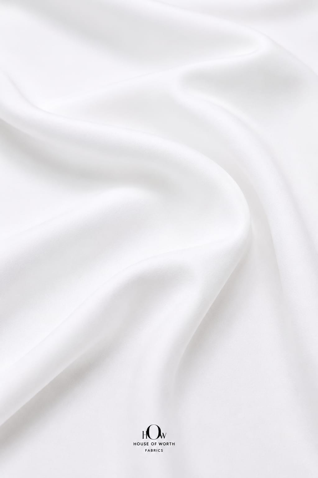 Soft white stretch Lycra fabric with fluid fall and refined surface.
