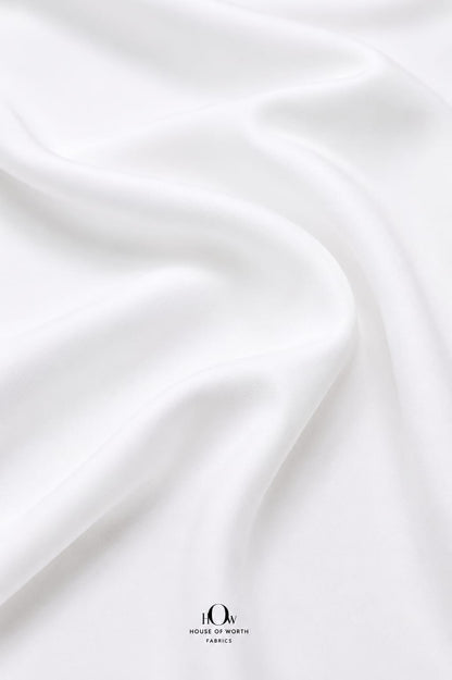 Soft white stretch Lycra fabric with fluid fall and refined surface.