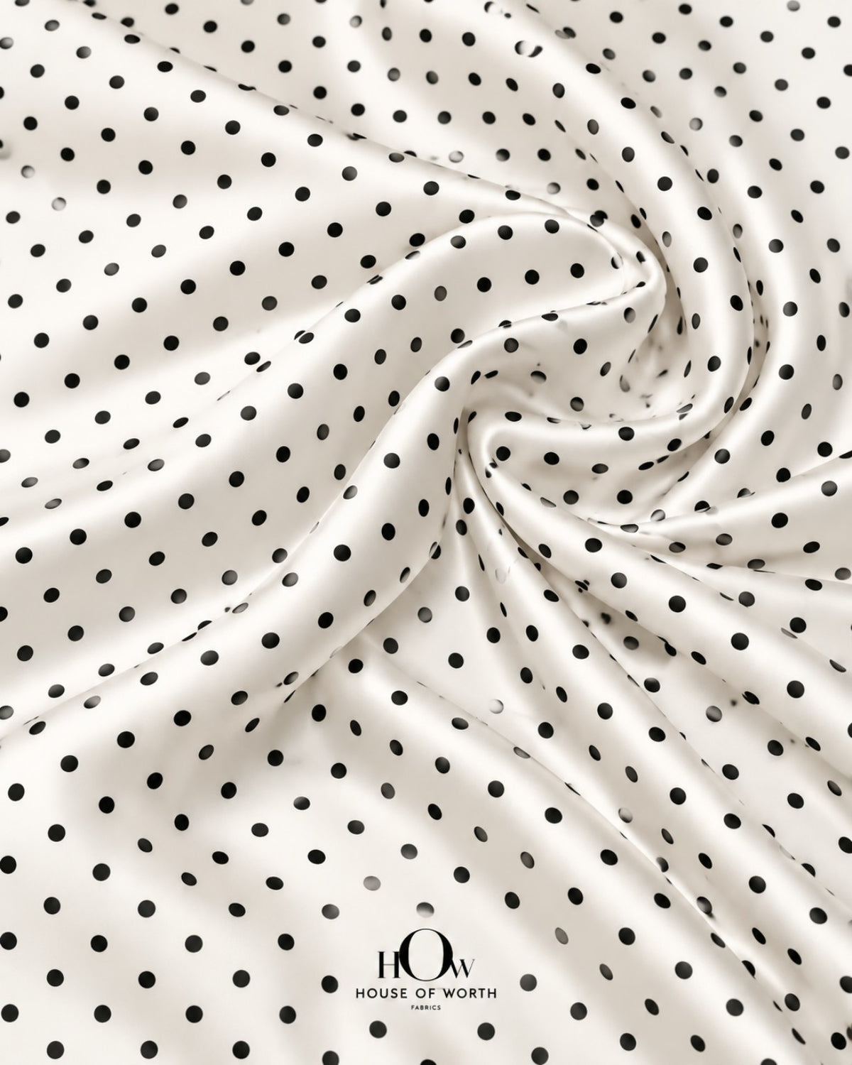 White satin with crisp black polka dots across a clean, smooth-looking surface