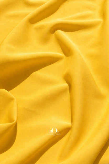 Close-up yellow banana crepe texture, premium heavy crepe fabric for boutique tailoring