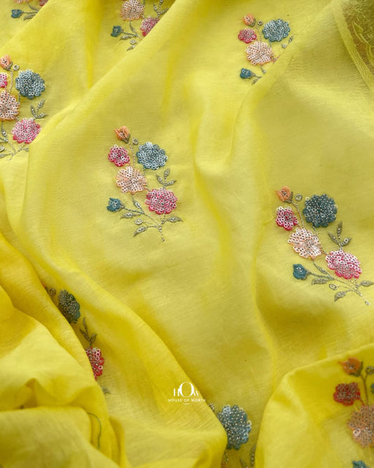 Yellow pure mul chanderi showing delicately spaced floral butti motifs