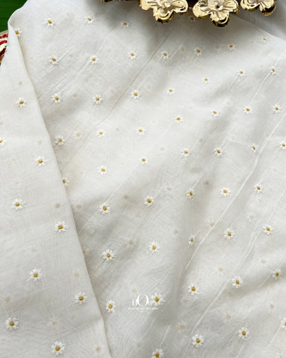 Draped white Mul Chanderi with subtle sheen and scattered yellow flower motifs
