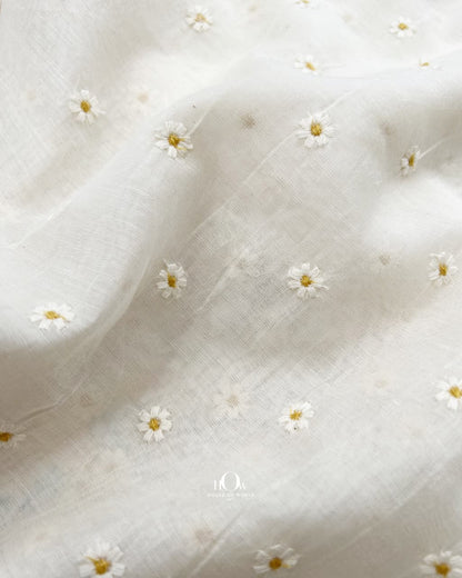 Close-up of tiny yellow flower butis embroidered on ivory Pure Mul Chanderi