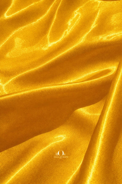 Premium yellow glass satin fabric ideal for gowns, sarees and party wear
