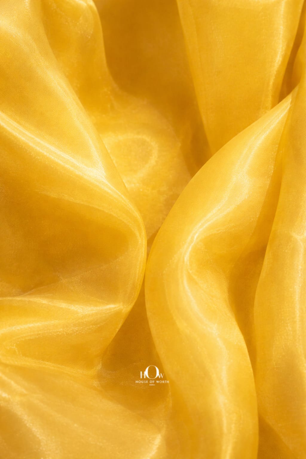 Yellow imported glass organza fabric with luminous sheen and airy drape