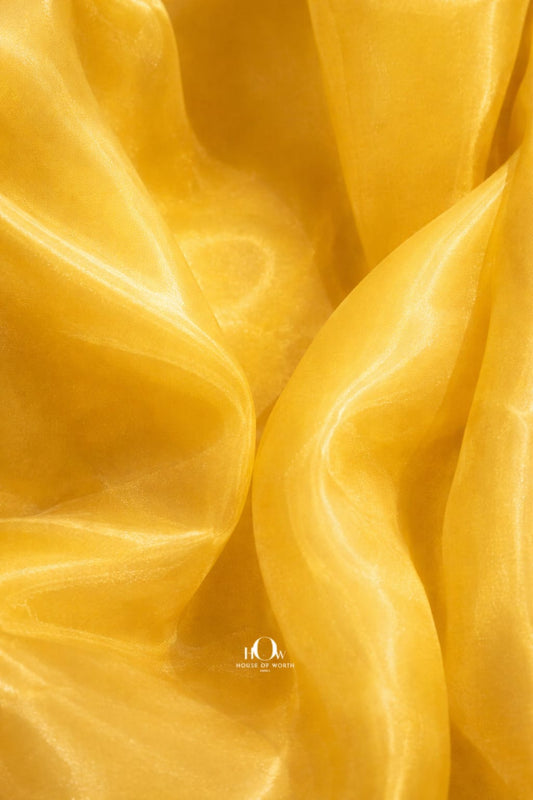 Yellow imported glass organza fabric with luminous sheen and airy drape