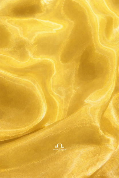 Premium yellow glass organza fabric for sarees, gowns, and western outfits
