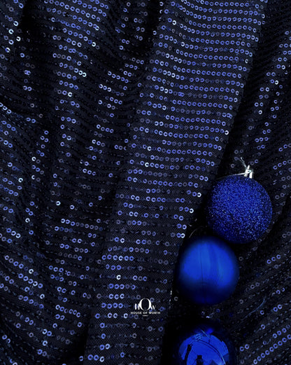 Navy blue imported sequins fabric – ideal for partywear and available from fabric wholesalers in Mumbai.
