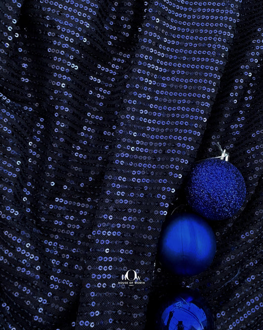 Navy blue imported sequins fabric – ideal for partywear and available from fabric wholesalers in Mumbai.
